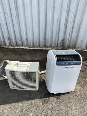 a small air conditioner and a small air conditioner on the ground
