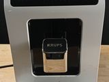 a coffee machine that is sitting on a wooden table