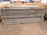 several stacks of lumber stacked on top of each other in a warehouse