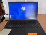 a laptop computer sitting on a desk with a price tag on it