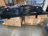 a lot of boxes that have been wrapped up in a warehouse