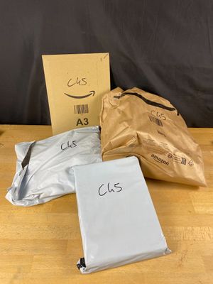 three bags of food sitting on a table next to a bag of food