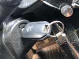 a close up of a car key on the steering wheel