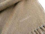 a close up of a brown blanket with writing on it