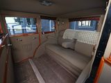 a view of the inside of a car from the driver ' s seat