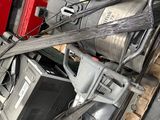 a pile of assorted electrical equipment in a garage