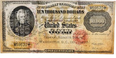 un gros plan d'un ancien billet de banque sur lequel figure le portrait d'un homme