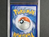 a close up of a pokemon card in a plastic case