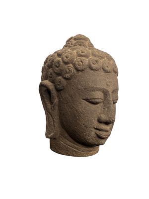 statue représentant une tête de Bouddha sur fond blanc