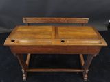 an old wooden desk with two drawers and a drawer underneath it