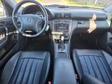 the interior of a car with black leather seats and a steering wheel