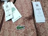 a bag that has a tag on it and a tag attached to it