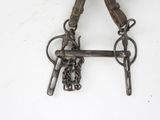 a close up of a pair of scissors on a chain