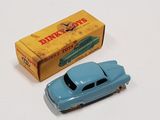 a blue toy car next to a yellow box