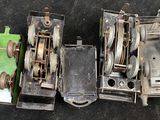 four different types of toy trains sitting on the ground