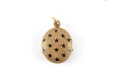 a close up of a gold locke with stars on it