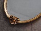 a mirror that is sitting on the floor in the room