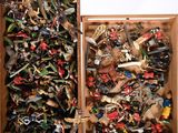 two wooden boxes filled with assorted toy animals