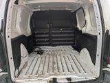 a white van with a bed in the back of it