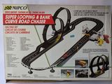 a box that has a model of a car track in it