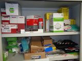 many boxes and packages on the shelves in the closet