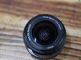 a camera lens sitting on a wooden table