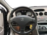 dashboard of a car with a steering wheel and dashboard controls