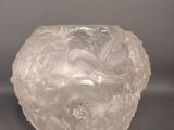a glass vase that is sitting on a table