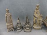 a lot of statues that are sitting on a table