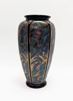 a vase that is sitting on a white surface