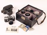 a black case with a camera and other items in it