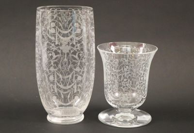 two vases sitting next to each other on a table