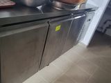 a stainless steel counter with a bowl on top of it