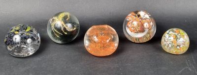 six different types of marbles sitting on a black surface