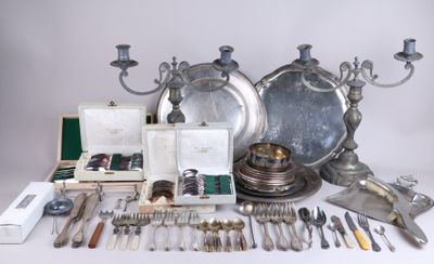 a lot of silverware and silverware on a table