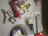 supplies laid out on a table including scissors, wire, scissors, and other items