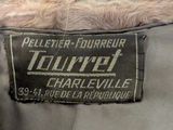 a label on the back of a jacket that says tourret charlesville