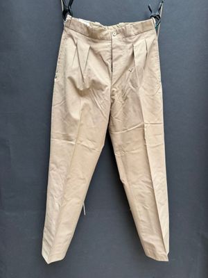 an old pair of pants hanging on a clothes hanger