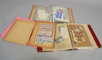 three open books sitting on a table with stamps on them