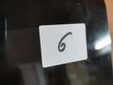 a close up of a cell phone with a sticker on it