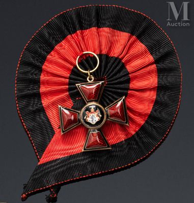 a red and black ribbon with a cross on it