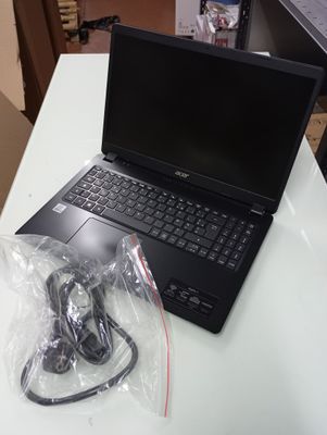 a laptop computer sitting on top of a white table
