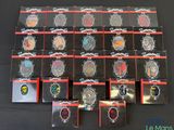 a lot of badges that are on display on a table