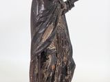 statue of a woman holding a bird in her hand on a white background