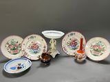 many plates and bowls that are sitting on a table