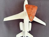 a model of an airplane with a wooden seat