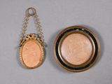 an image of a gold locke with a coin hanging from it
