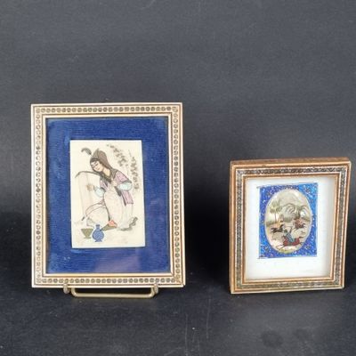two framed pictures of a woman and a child on a black background