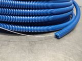 a close up of a blue hose sitting on top of a table