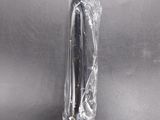 a black and white photo of a knife in a plastic bag